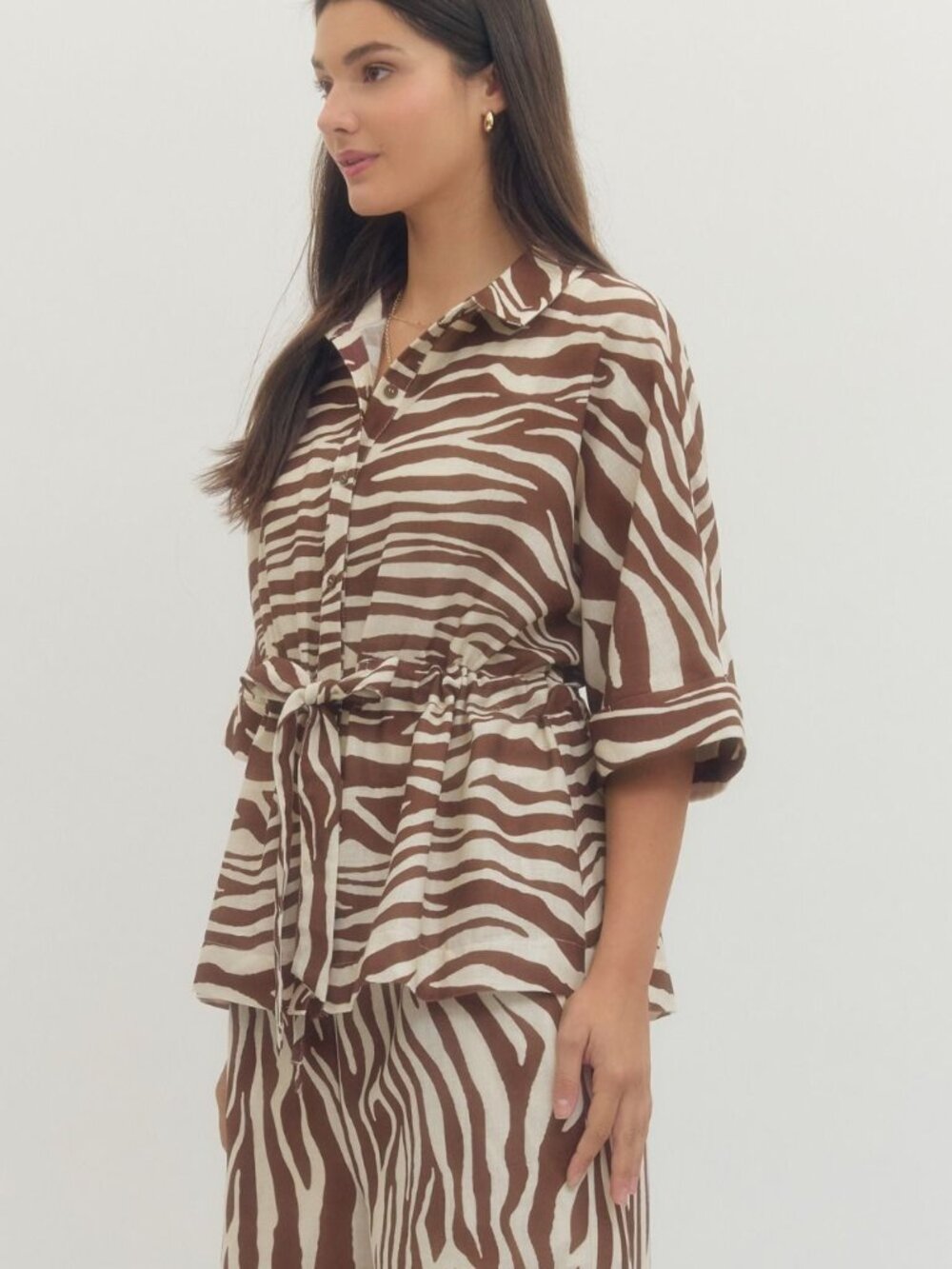 Zebra print button-up top featuring a tie at the waist.